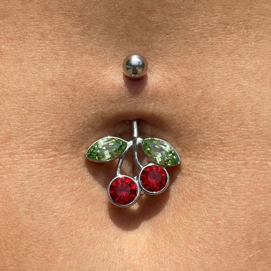 Cherry Red Green CZ Belly Ring 14G 316L Surgical Steel in the belly piercing of a model.