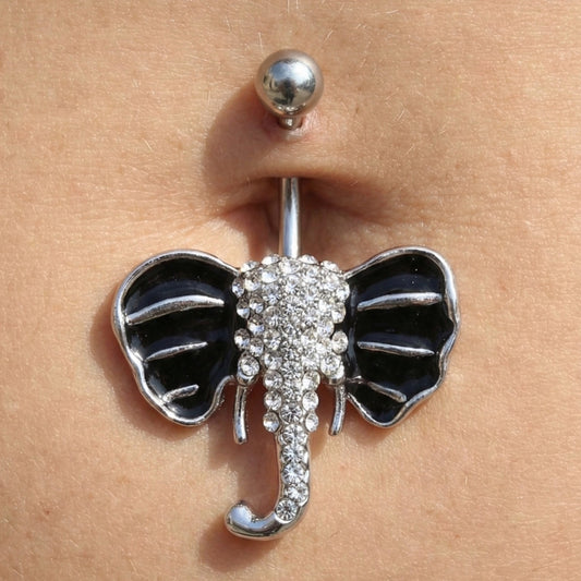 Belly button ring with elephant design on the belly of a female model.
