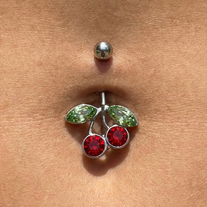 Cherry Red Green CZ Belly Ring 14G 316L Surgical Steel in the belly piercing of a model.