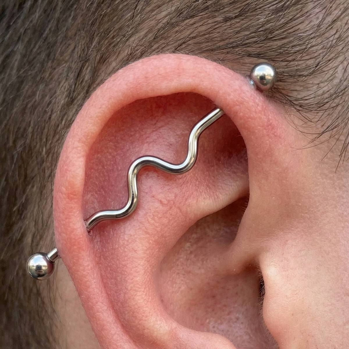 Wavy Industrial Barbell 14G 316L Surgical Steel Right Ear.